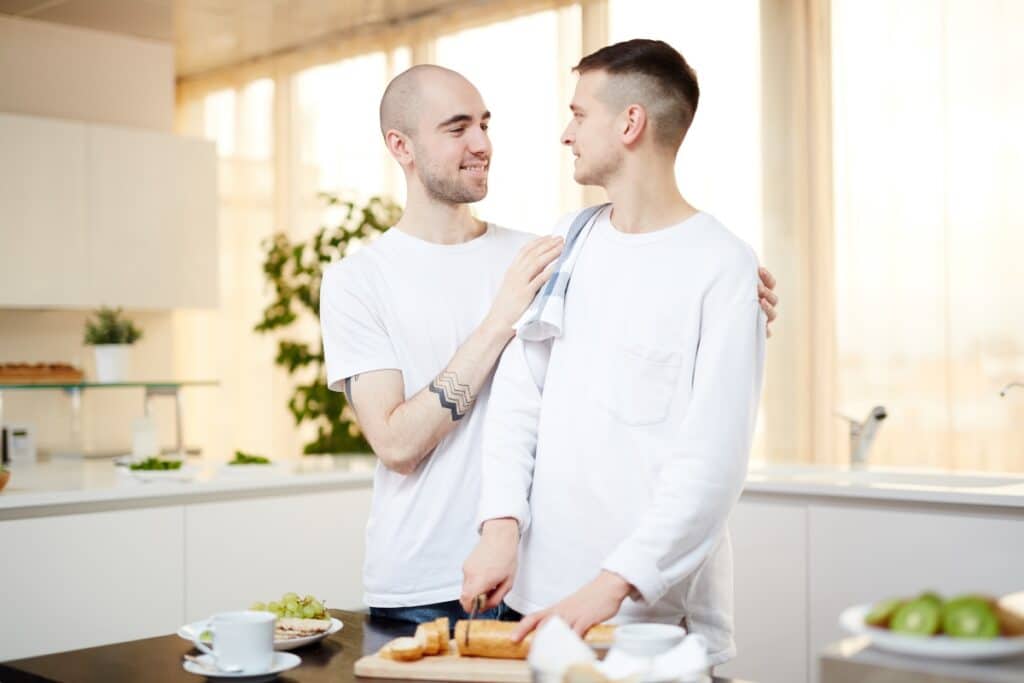 Gay couple at home, with one finding it challenging to live with an alcoholic