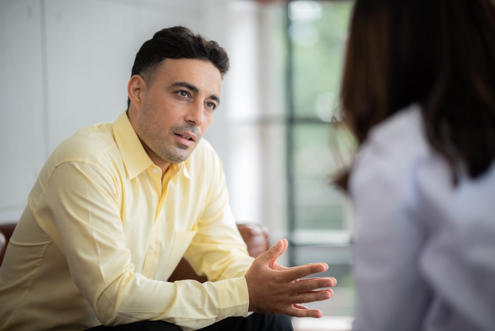 lgbtq man in los angeles talking with therapist about coping skills for relapse prevention