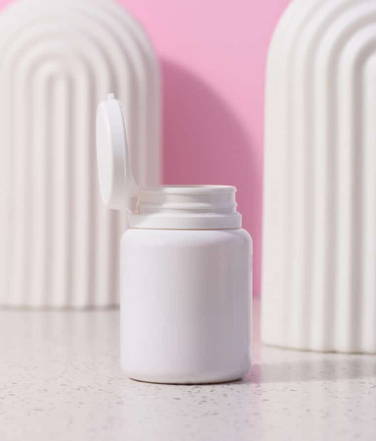 pill bottle with pink background - k18 pills