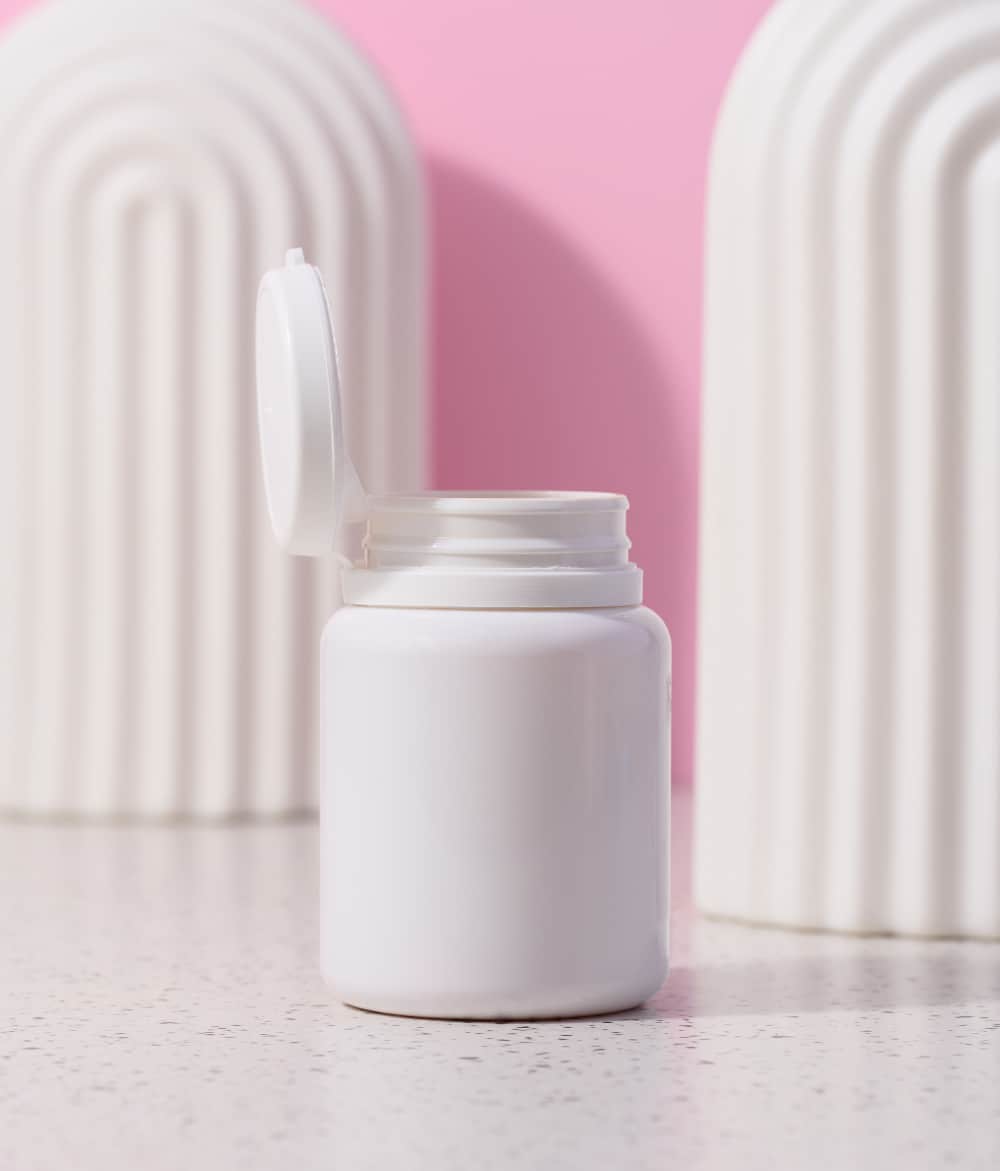 pill bottle with pink background - k18 pills