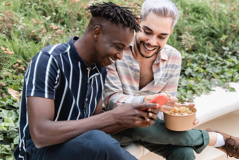 gay lgbtq+ couple out on a date in a park - dating in sobriety sober dating i the lgbt community