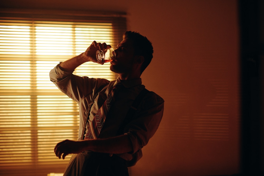 young man drinking - black out drunk