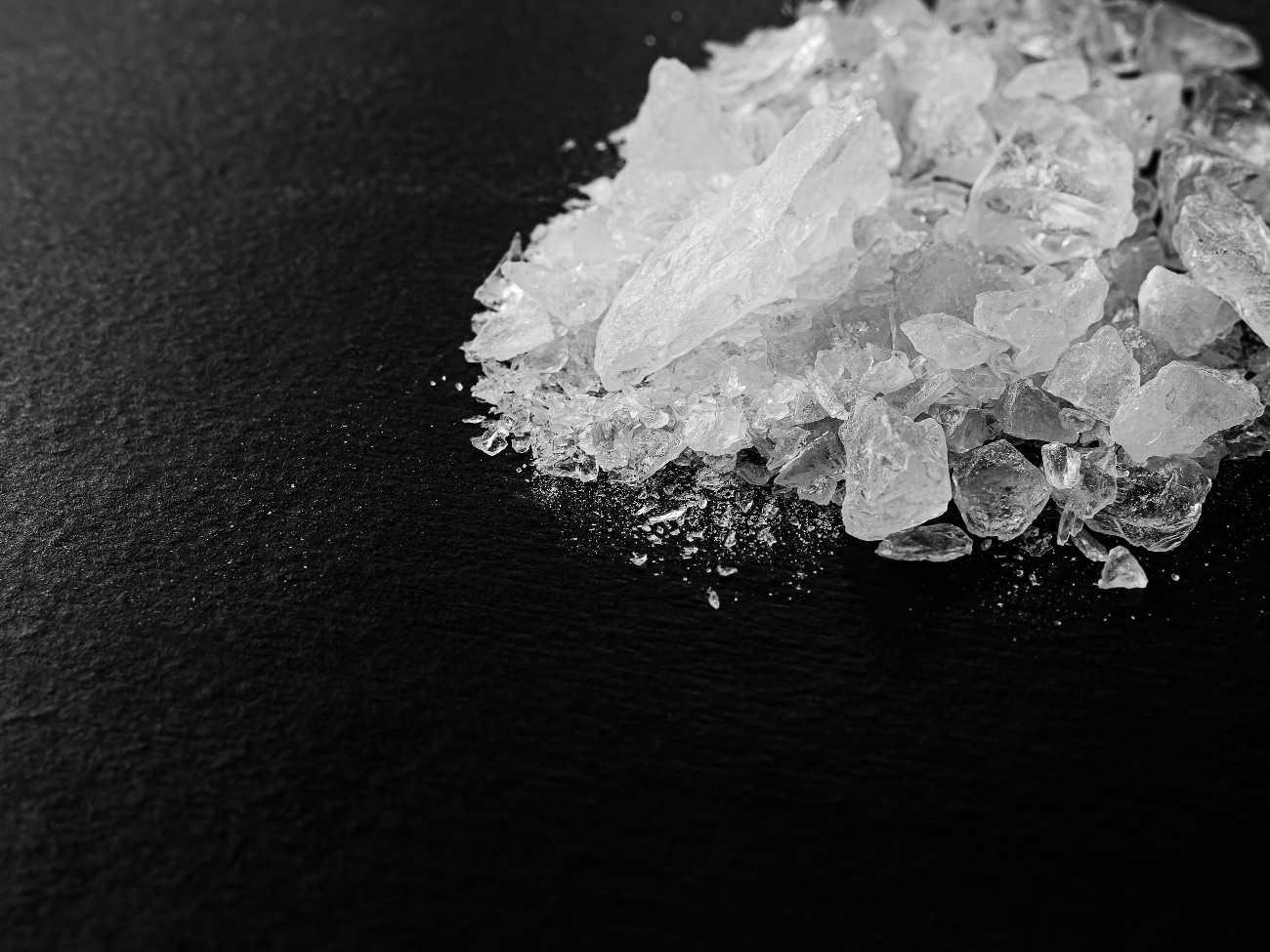 crystal meth on a black table - chemical composition of crystal meth
