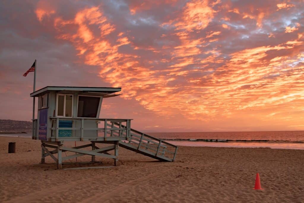 sunset at santa monica beach in los angeles california. - california sober