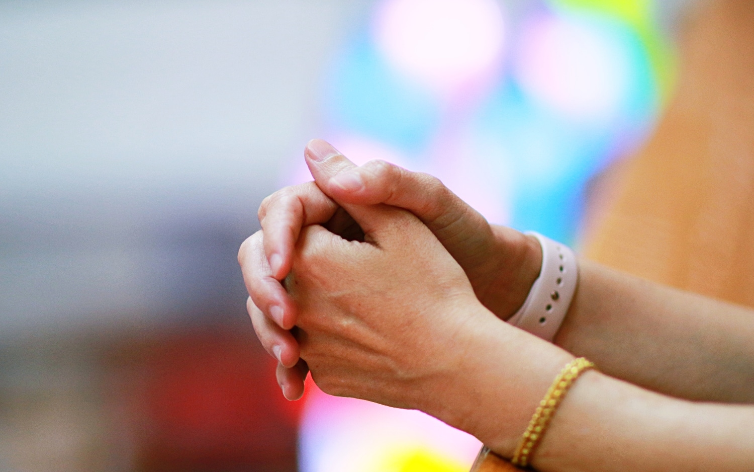 woman praying close up of hands - religious trauma and recovery