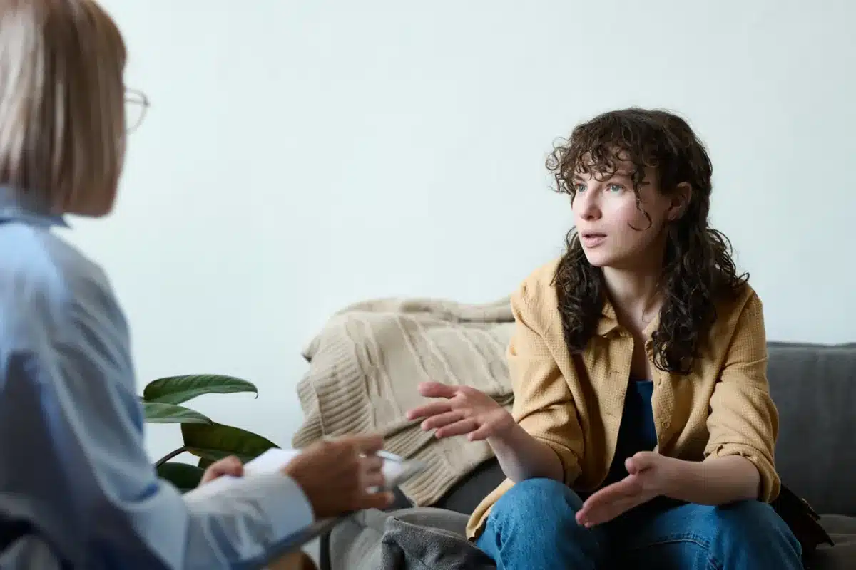 Diverse group in an LGBTQ+ affirming IOP therapy session sharing openly in a welcoming Los Angeles setting