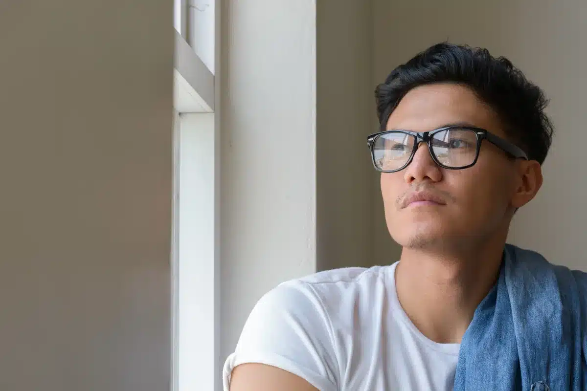 Supportive LGBTQ+ adult in a supervised detox setting reflecting fentanyl-aware treatment in the queer community